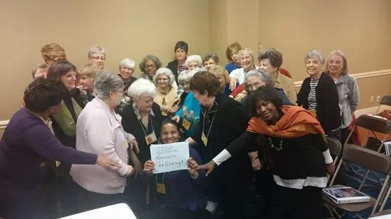 Photo of Texas Conference huddling against human trafficking.